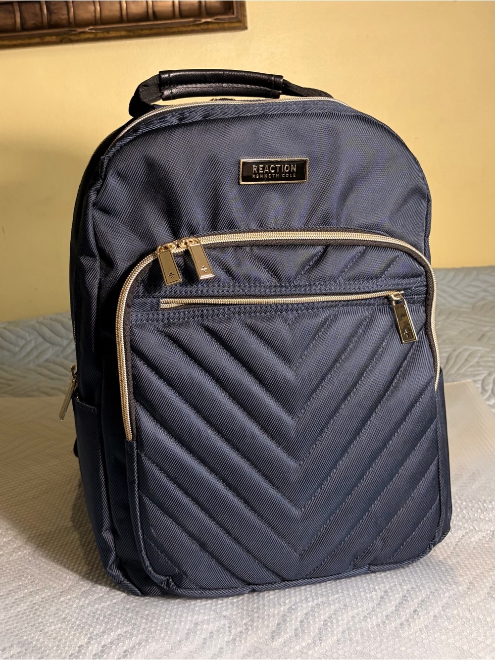 Kenneth Cole Reaction navy quilted-front backpack with gold trim